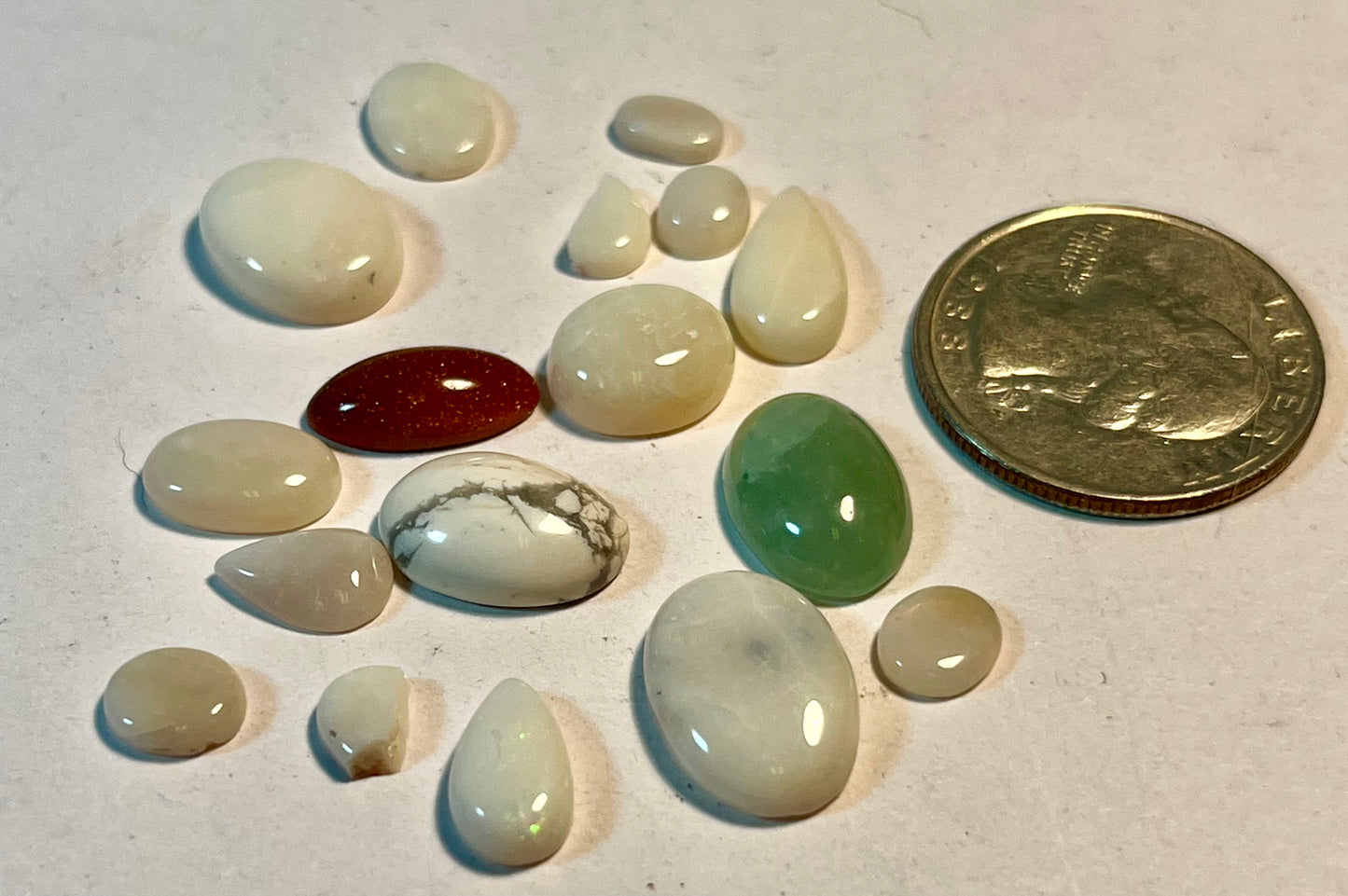 Assortment of Polished Cabochons + Facet-Cut Gems