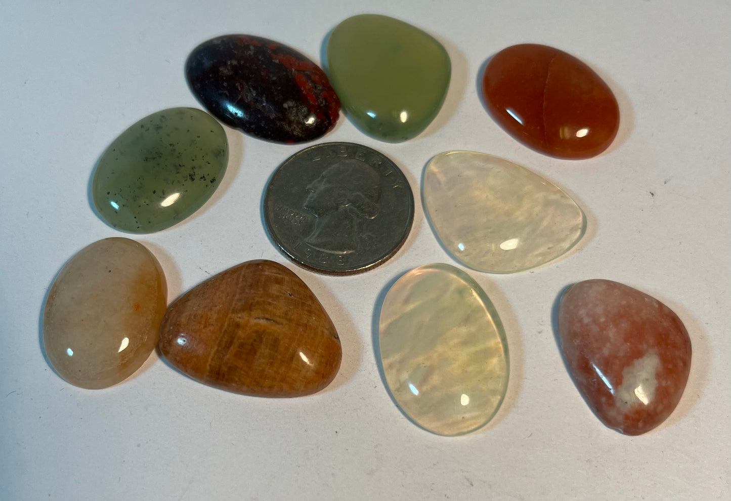 Assortment of Polished Cabochons + Facet-Cut Gems