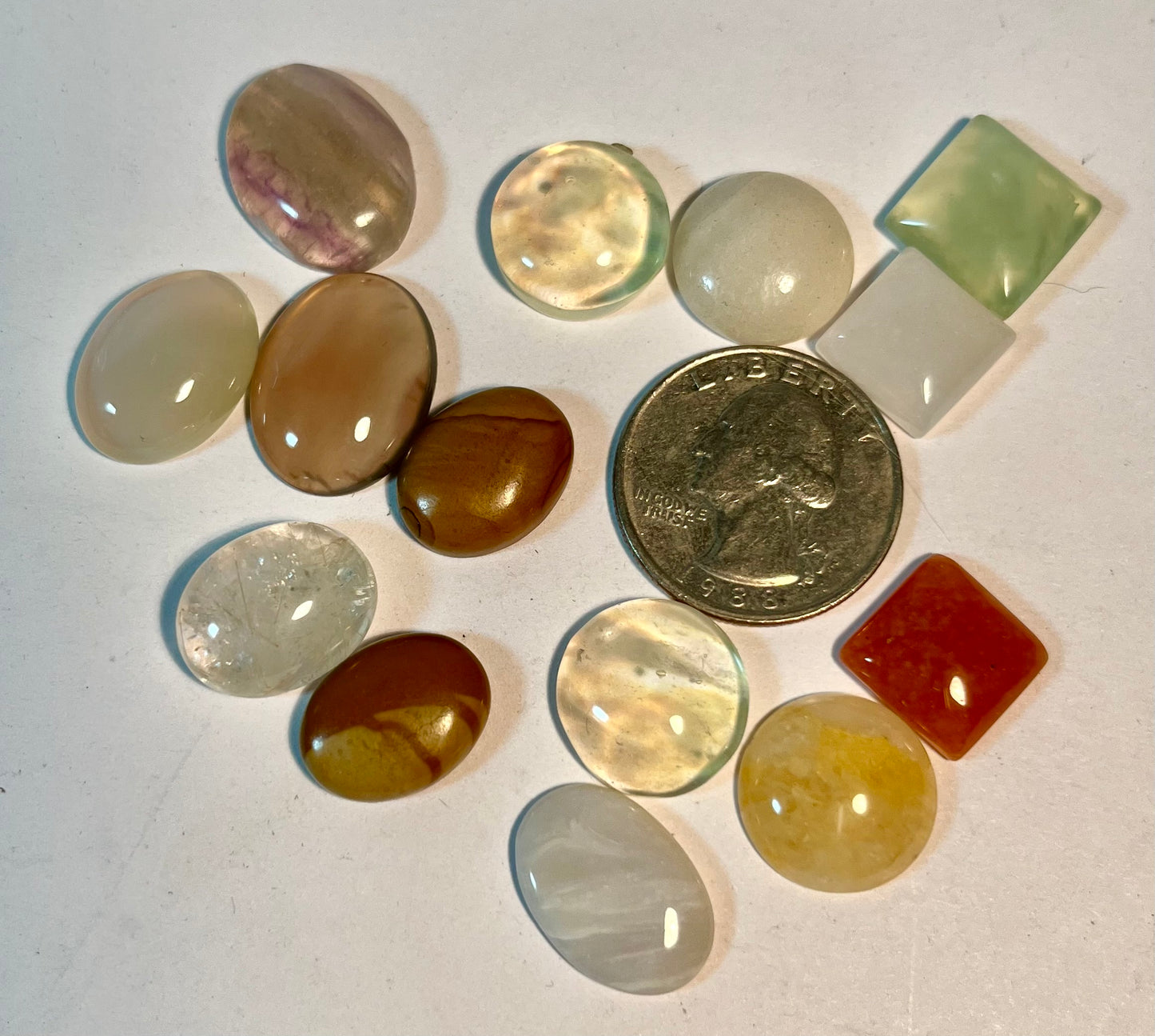 Assortment of Polished Cabochons + Facet-Cut Gems