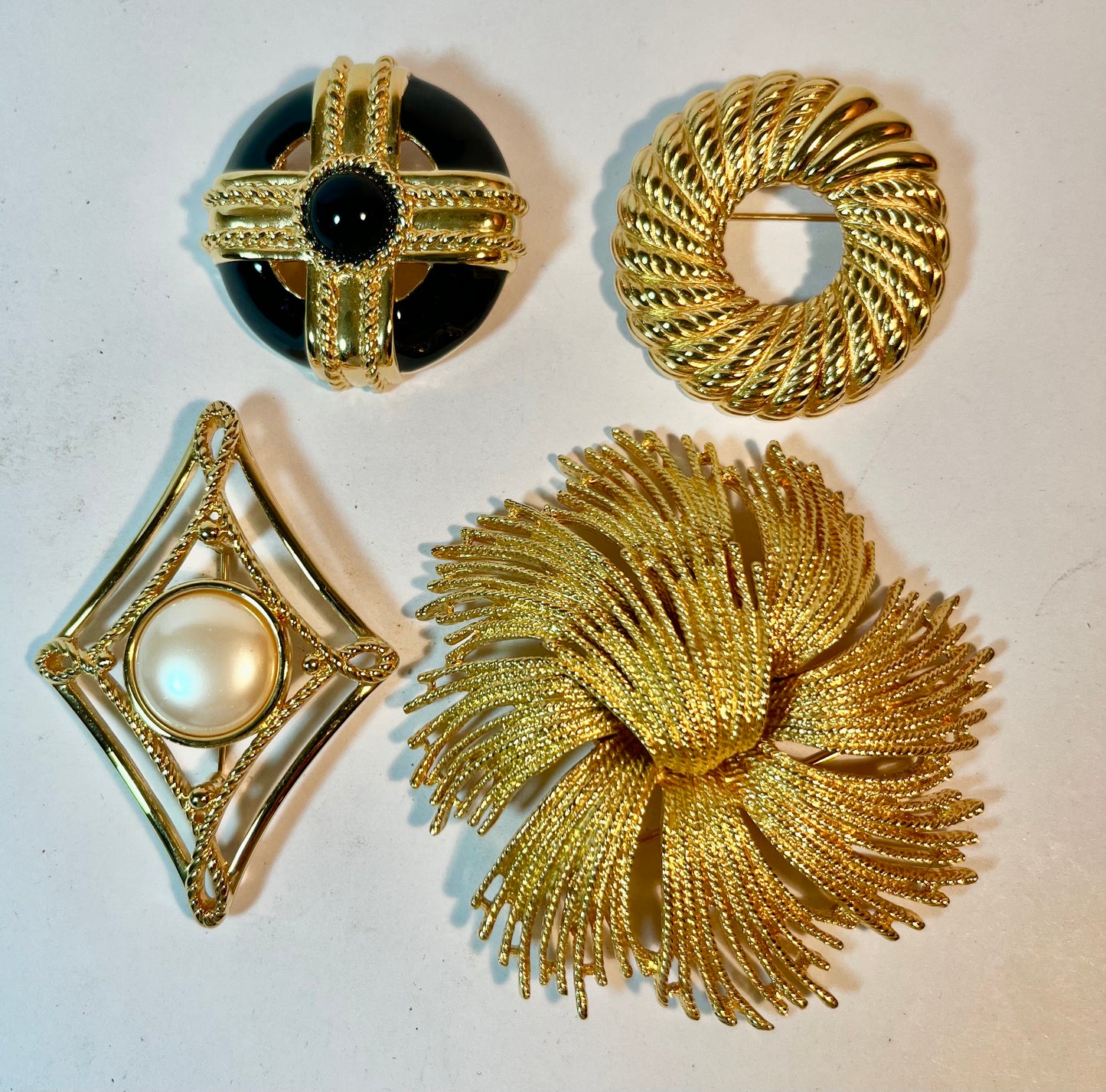 Four Monet Brooches