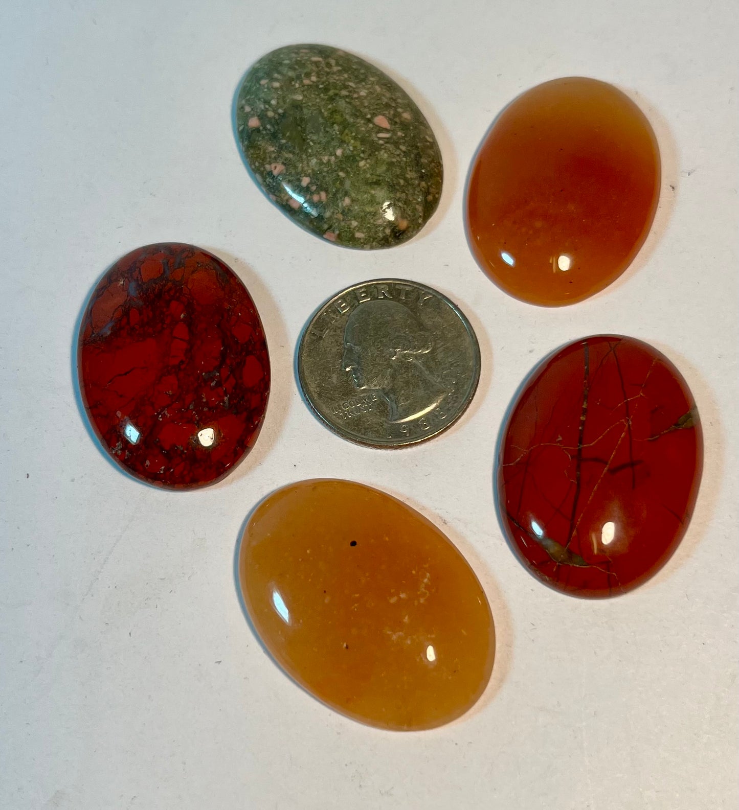 Assortment of Polished Cabochons + Facet-Cut Gems