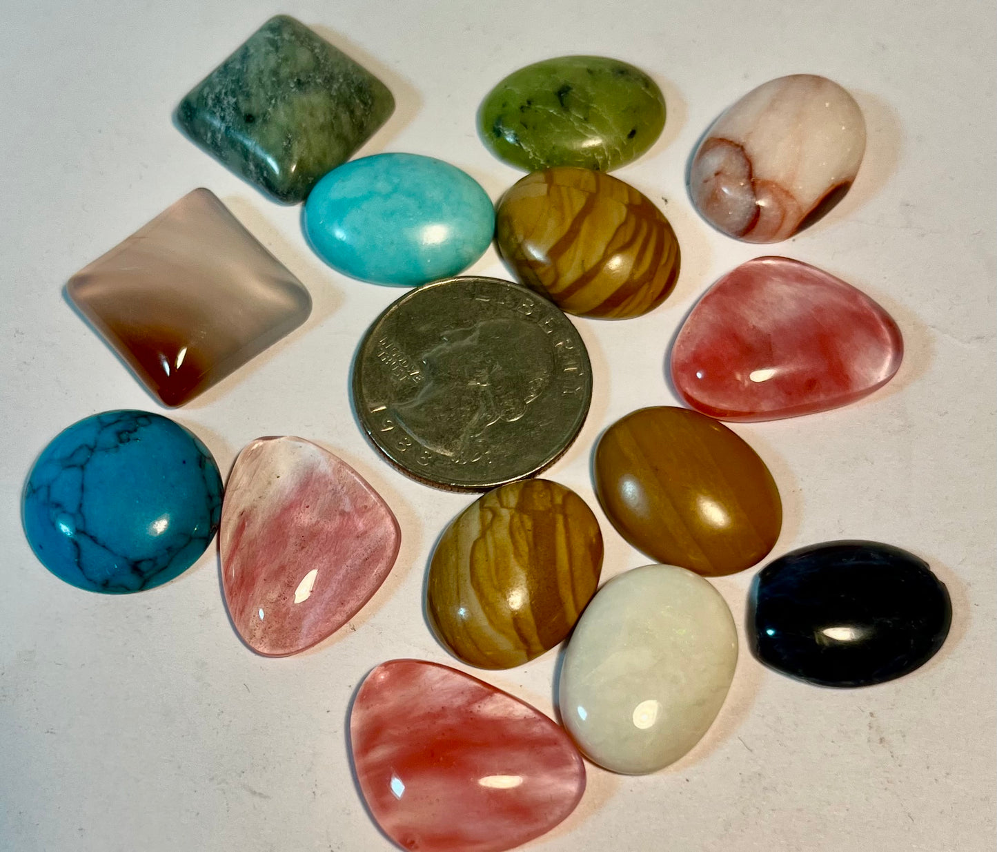 Assortment of Polished Cabochons + Facet-Cut Gems